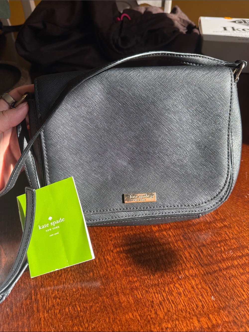 kate spade black textured leather crossbody with gold-tone logo